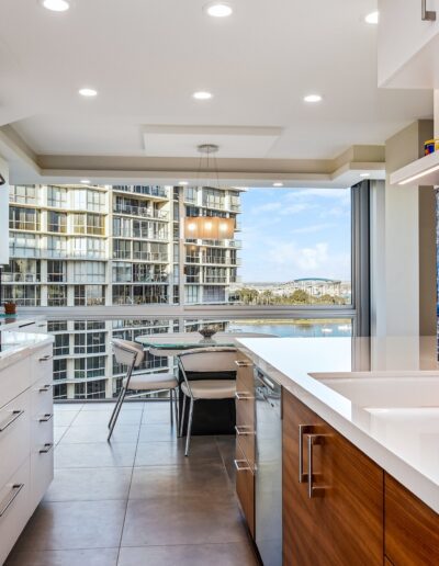 A kitchen with a blue glass backsplash.